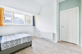 Place the bed diaganally to the door